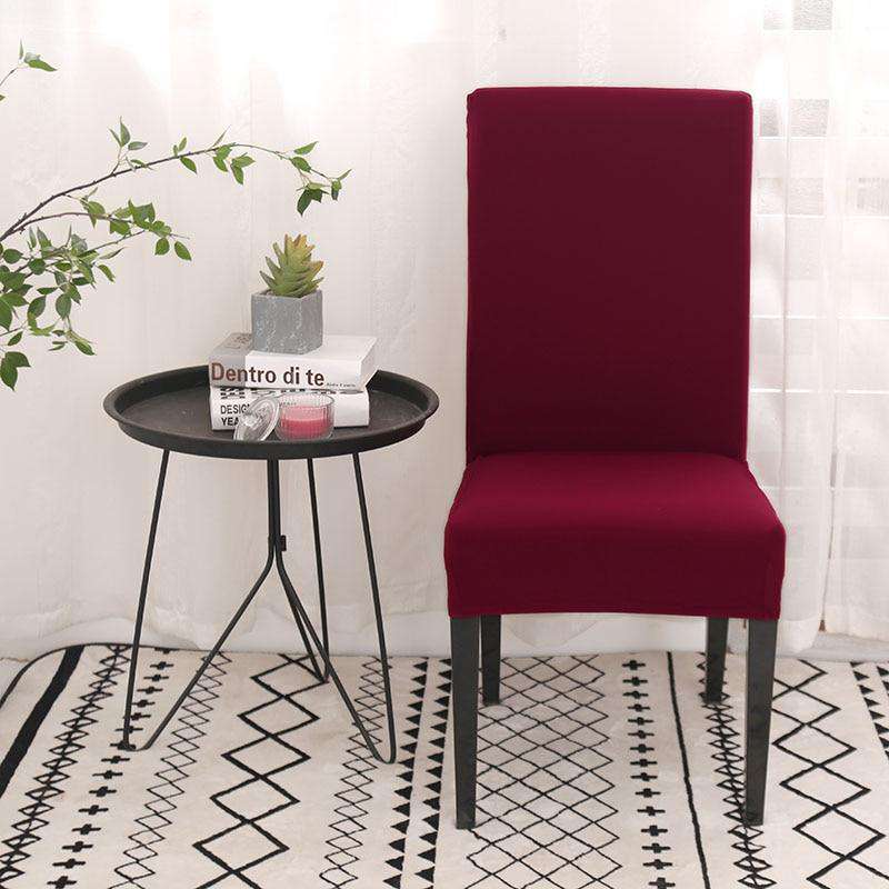 Fundas de silla universales de color rojo intenso para decoraci??n moderna, con mesa redonda negra y alfombra estampada, a la venta en blueemoonco.com